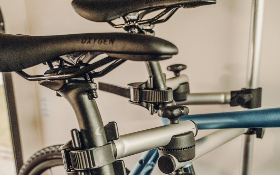 Close-up of two bike saddles in a bicycle rack inside the vehicle