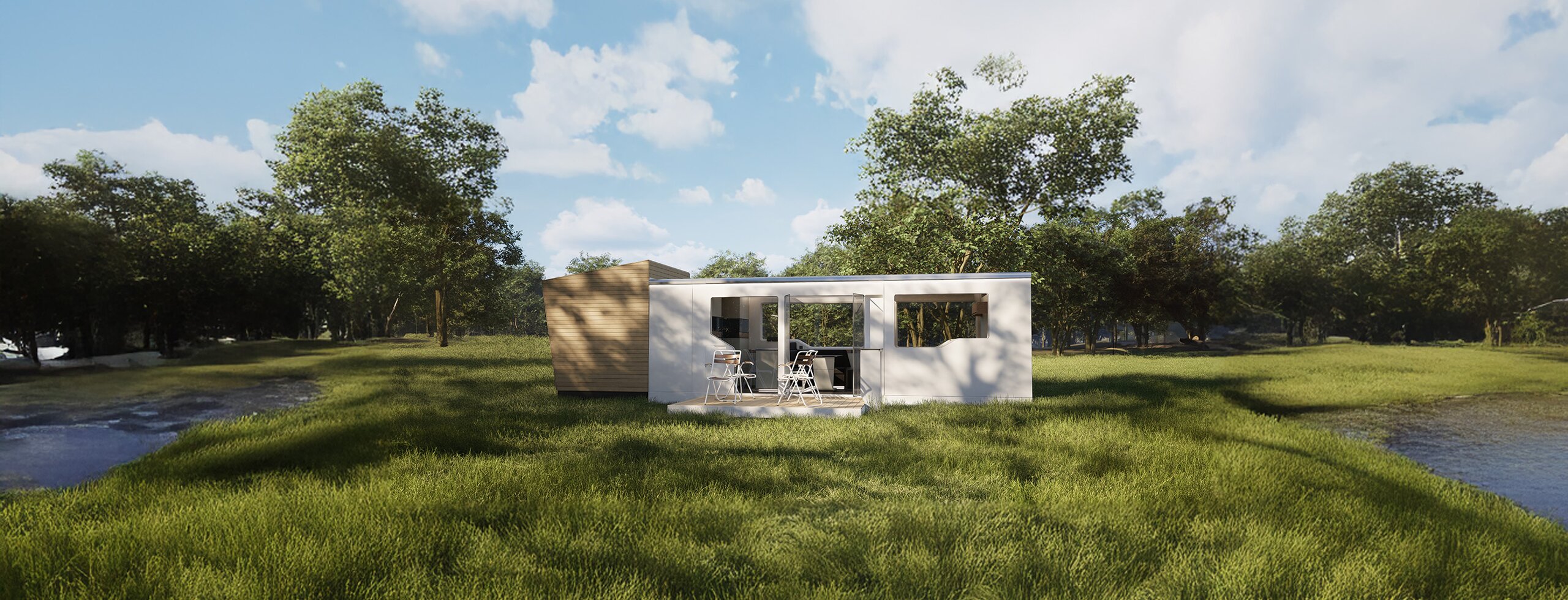 Kleines Mobilheim mit Terrasse und Sitzgruppe auf Wiese am Waldrand