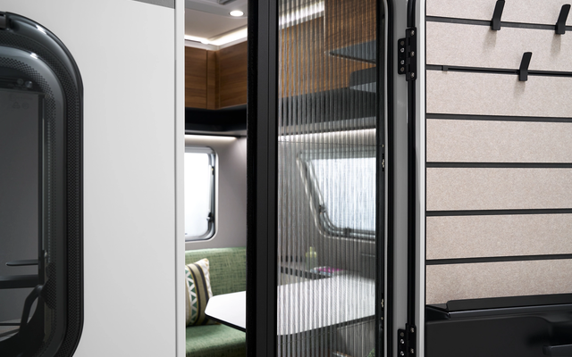 The fly screen keeps insects out and blends in visually with the overall picture.