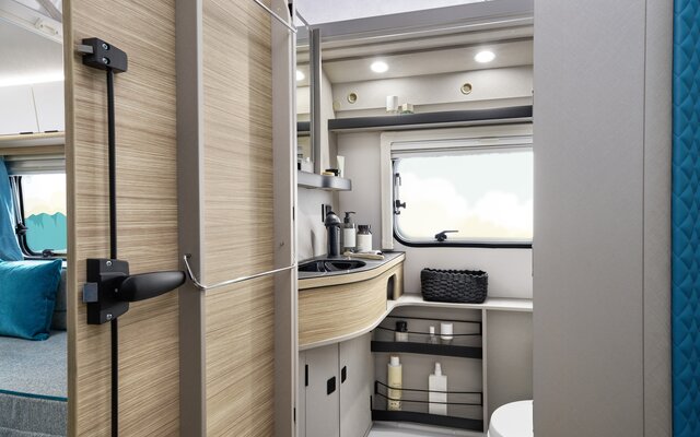 The clever layout of the bathroom cabinets and storage compartments creates plenty of space in an economical area.
