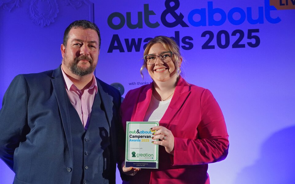 Press Picture | Iand Duff and Emma Hughes with the Out & About Live Campervan Award for the ERIBA Car