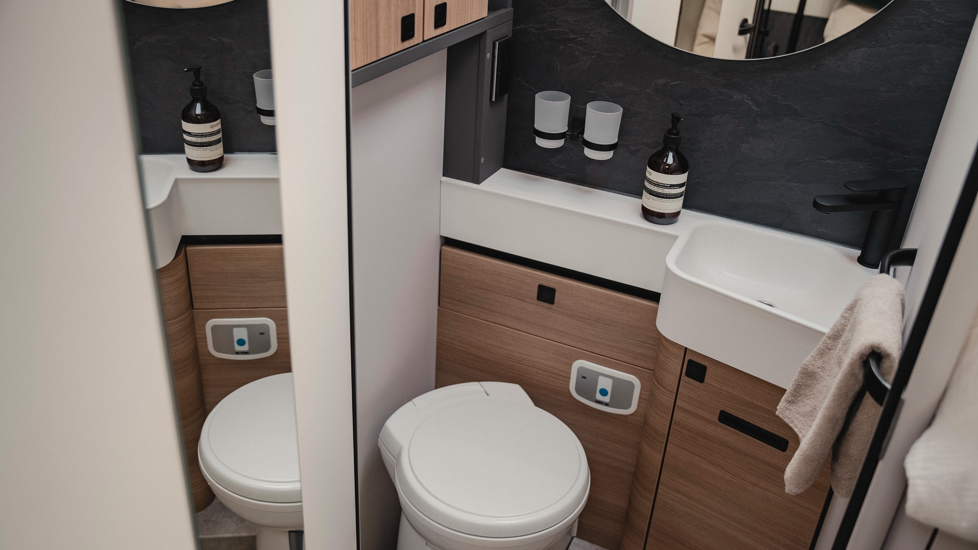Compact and thoughtful: The bathroom, here in Matara Teak furniture decor, impresses with clever layout and separate shower option - for maximum comfort on the road.