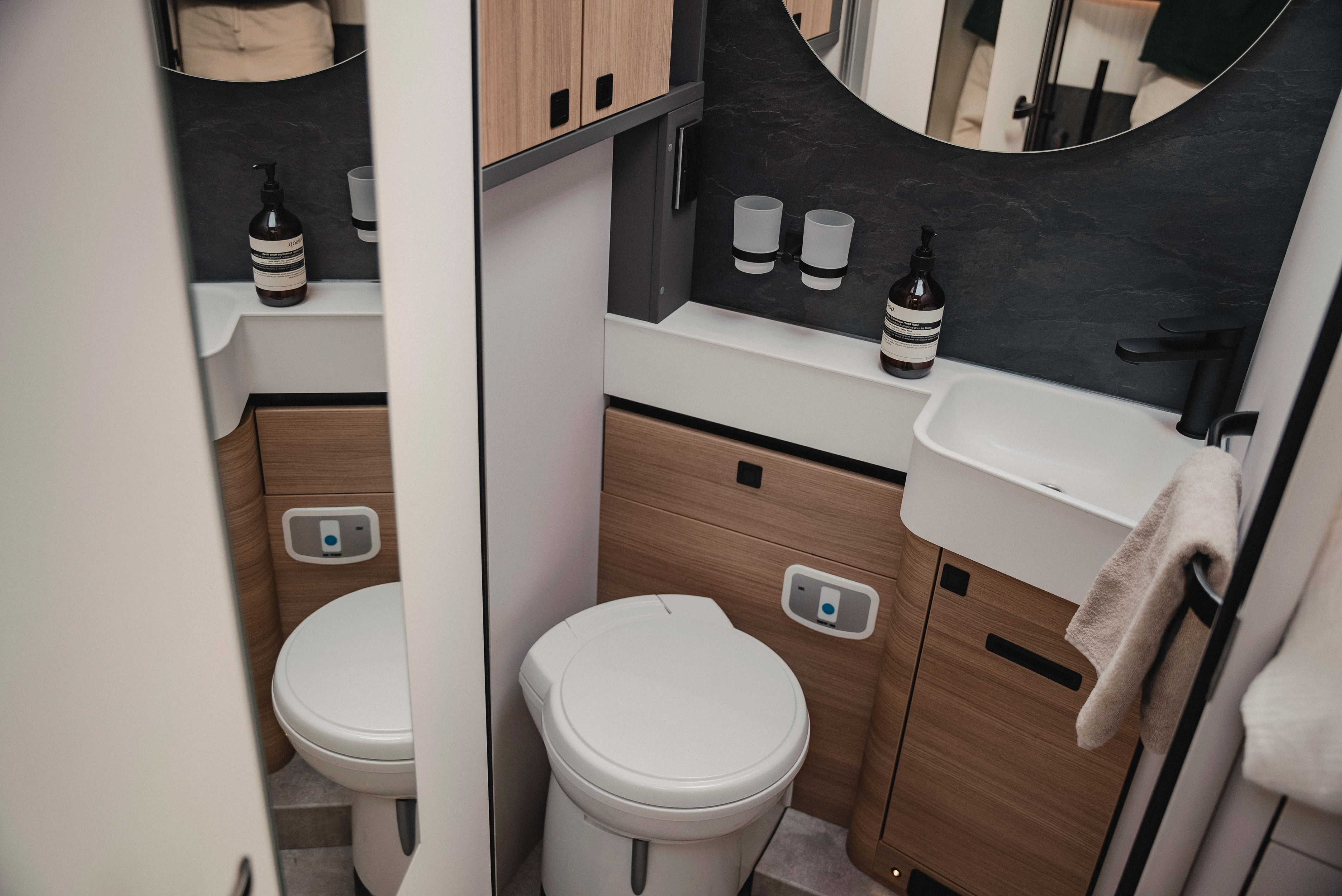 Compact and thoughtful: The bathroom, here in Matara Teak furniture decor, impresses with clever layout and separate shower option - for maximum comfort on the road.