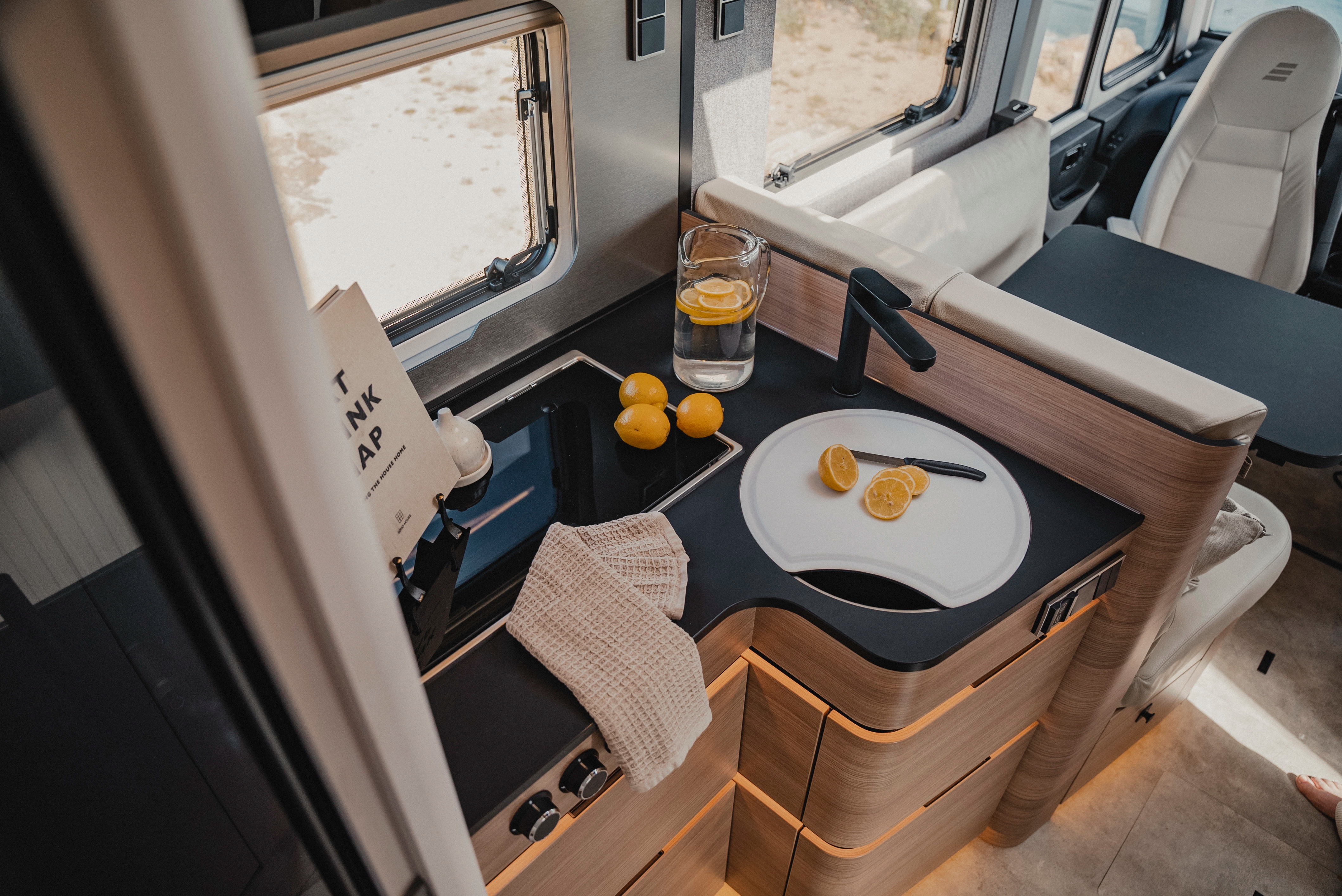 The kitchen, here in Matara Teak furniture decor, is the central hub where everything is within reach. Thoughtful storage solutions and a compact arrangement make cooking a pleasure.