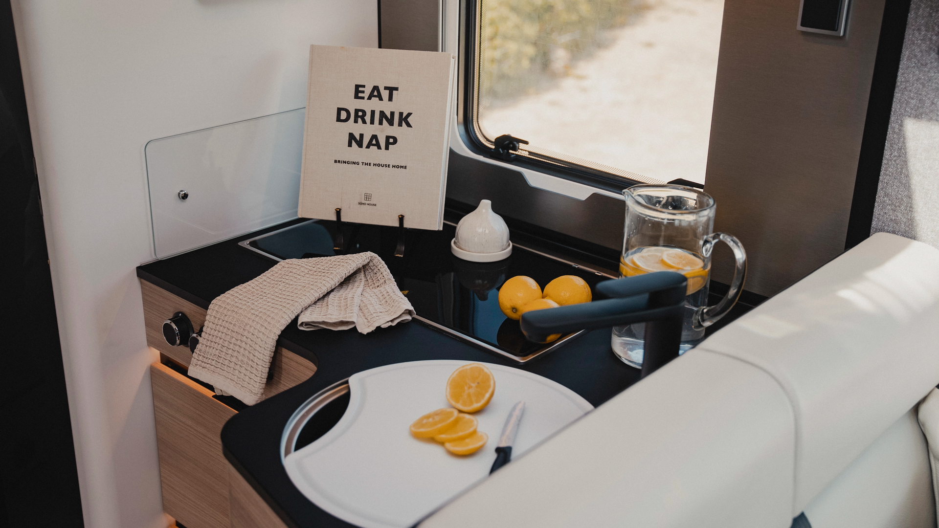 The stylish kitchen in Matara Teak furniture decor combines elegance and functionality in a compact space. Enjoy culinary creativity and freshness with a setup that offers stylish comfort for life on the road.