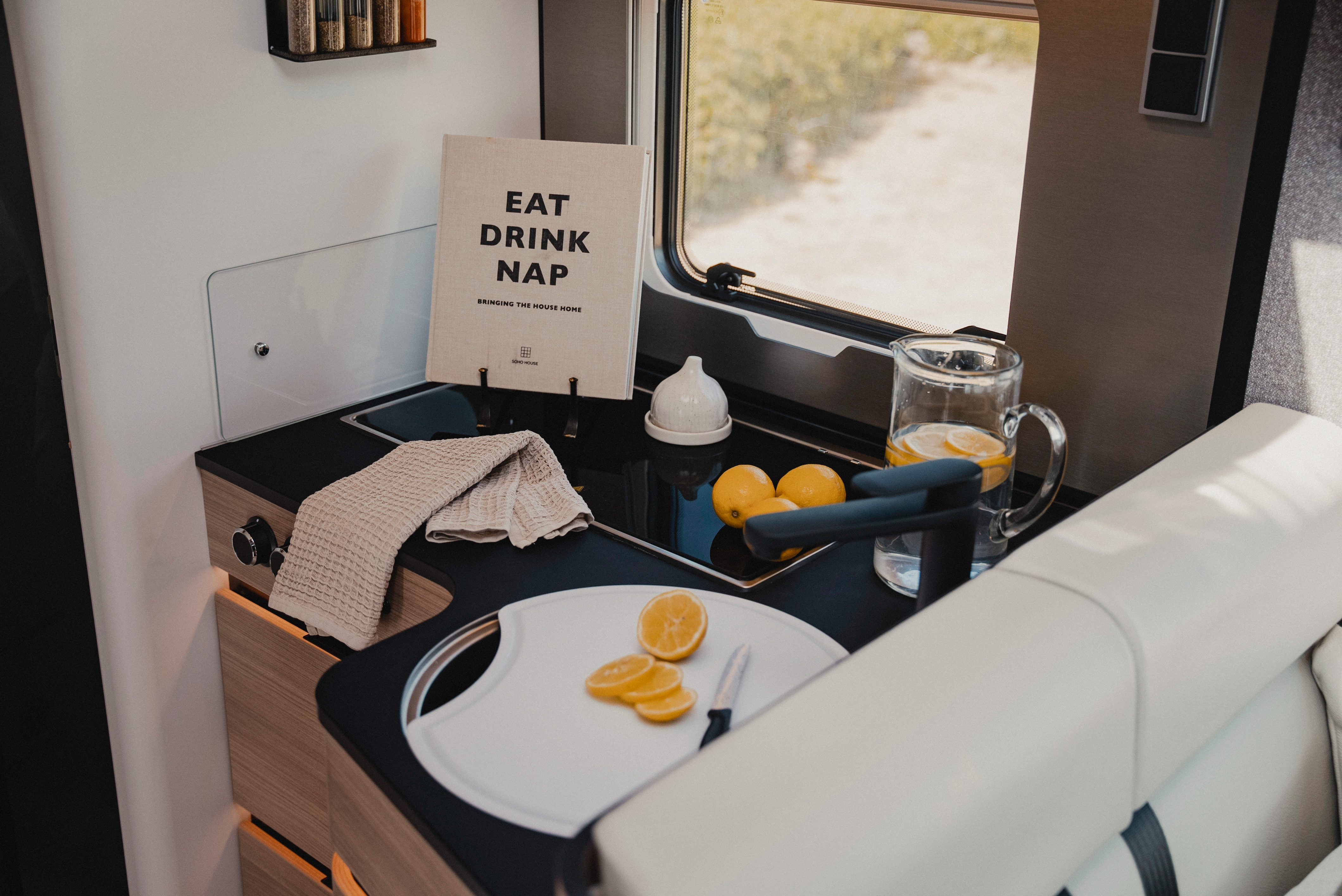 The stylish kitchen in Matara Teak furniture decor combines elegance and functionality in a compact space. Enjoy culinary creativity and freshness with a setup that offers stylish comfort for life on the road.