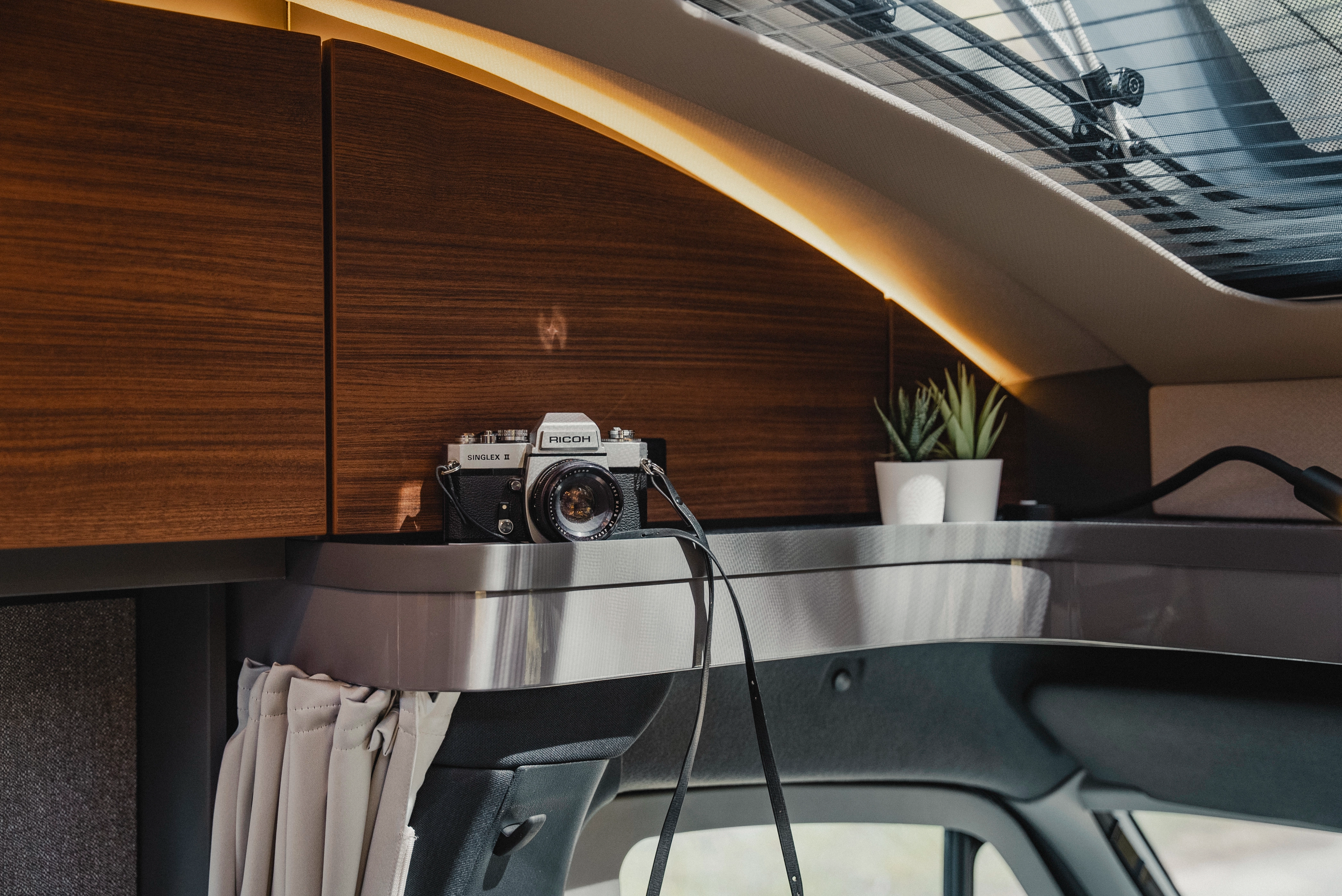 Practical storage compartments with style: On the storage surface above the cab, everything important finds its place and remains readily accessible.