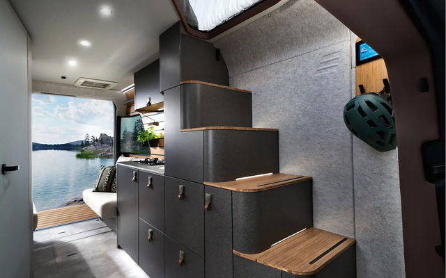 The comfort stairs of the HYMER Venture S with illuminated steps lead up to the Instant Loft.