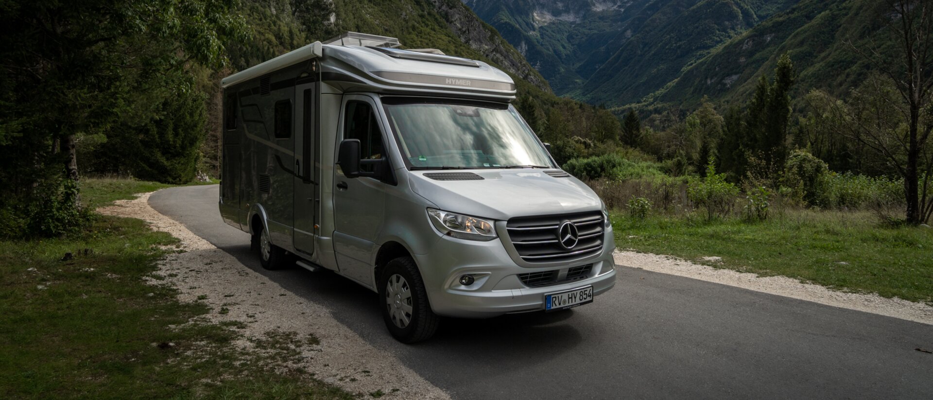 HYMER ML-T in front of a mountain setting