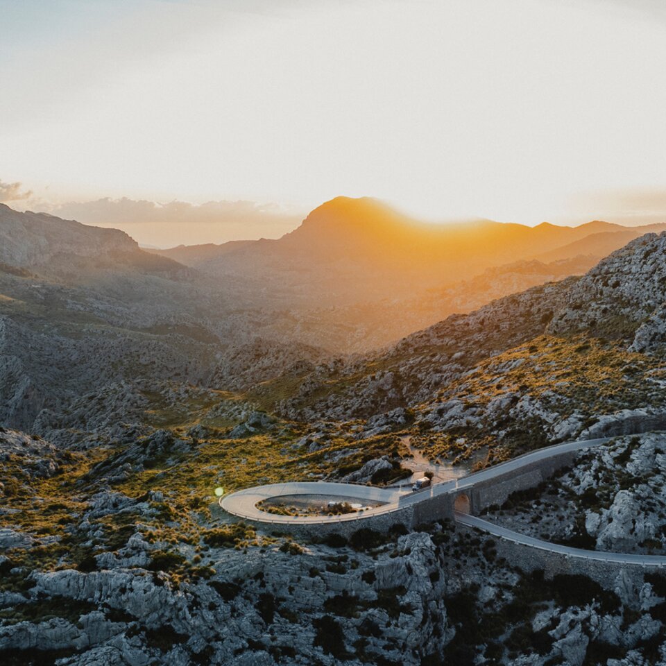 Winding road surrounded by mountains